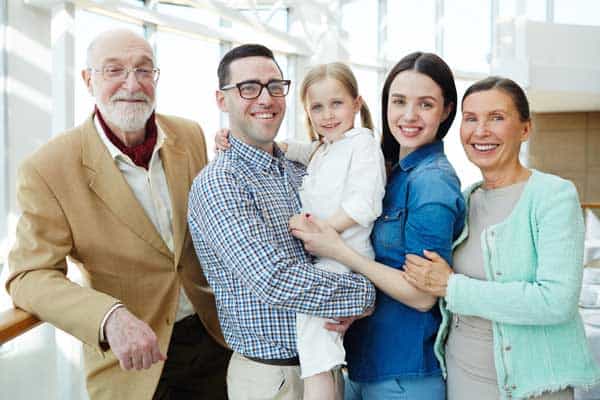 Smiling family of all ages.