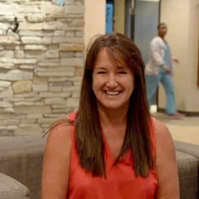 LASIK patient, Stephanie, sits in waiting room before her laser eye surgery exam.